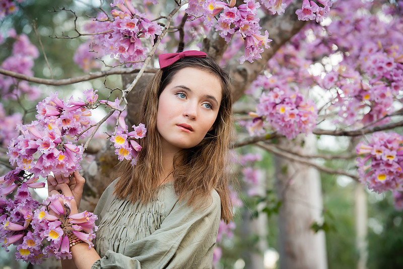 Young girl with pink blossoms
