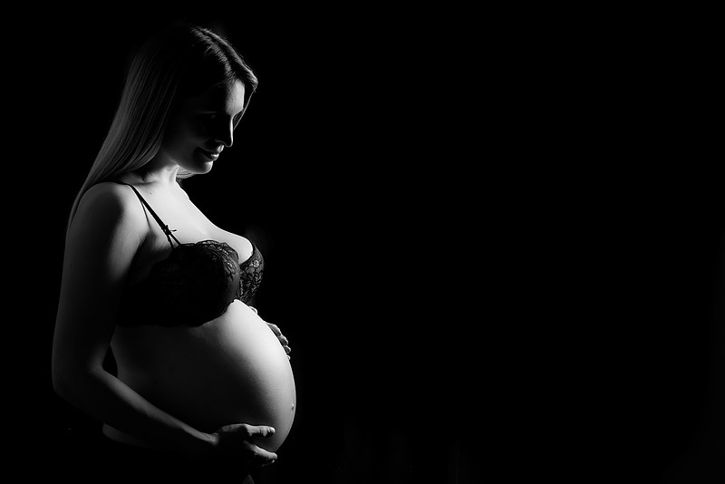 Black and white maternity studio portrait